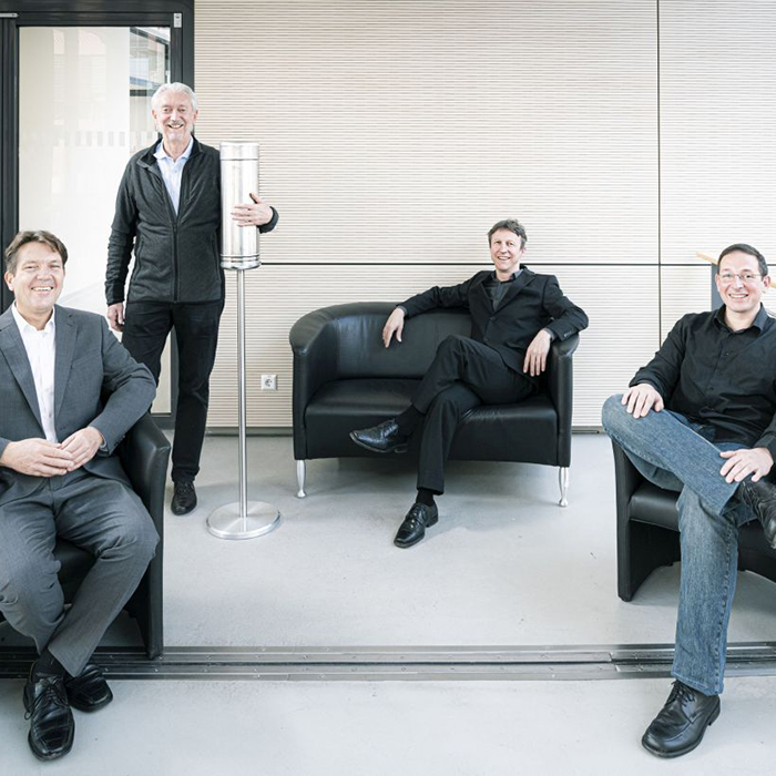 Aerobuster invented by Thomas Blank, Horst Hahn, Jochen Kriegseis, and Martin Limbach (from the left) guarantees virus-free air in the waiting area.